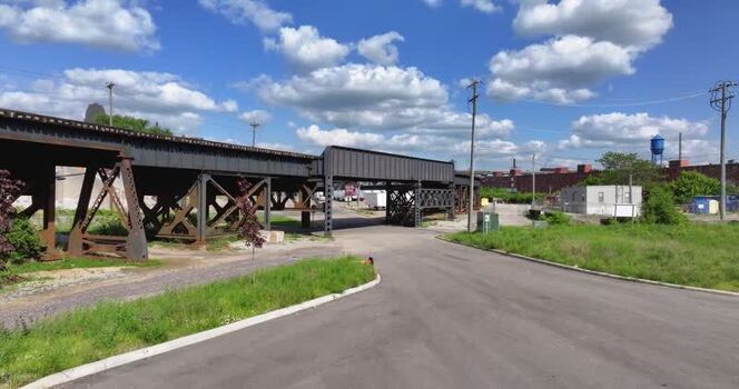 Aerial view of a steel railway overpass and road United States. Aerial view of a steel railway overpass and road United States.
