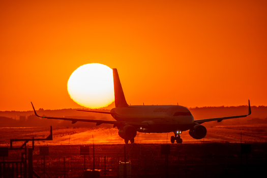 View of a Lufthansa airplane on the runway at sunset at Bucharest Henri Coanda International Airport in Otopeni Judetul Ilfov Romania. View of a Lufthansa airplane on the runway at sunset at Bucharest Henri Coanda International Airport in Otopeni Judetul Ilfov Romania.