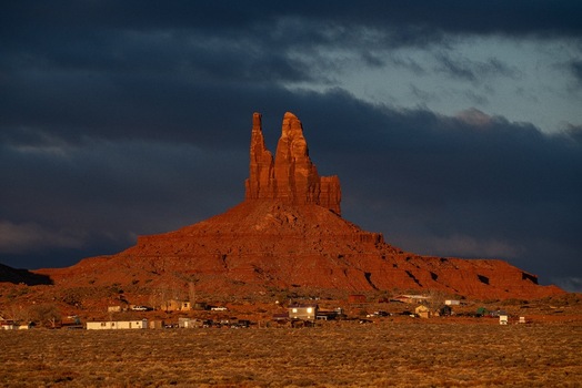 View of the iconic red sandstone buttes at Monument Valley Tribal Park under dramatic clouds in Oljato Monument Valley Utah United States.