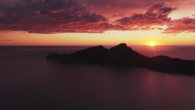 Aerial view of Sa Dragonera island silhouette at sunset Spain.