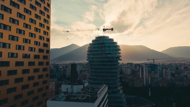 Aerial view of modern skyscrapers and mountains in Tirana Albania. Aerial view of modern skyscrapers and mountains in Tirana Albania.