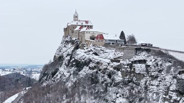 Aerial view of Riegersburg Castle on a snowy cliff Austria.