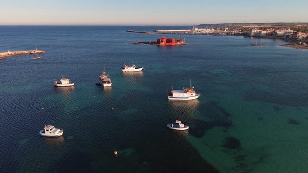 Aerial view of fishing boats and Isolotto Brancati Italy. Aerial view of fishing boats and Isolotto Brancati Italy.