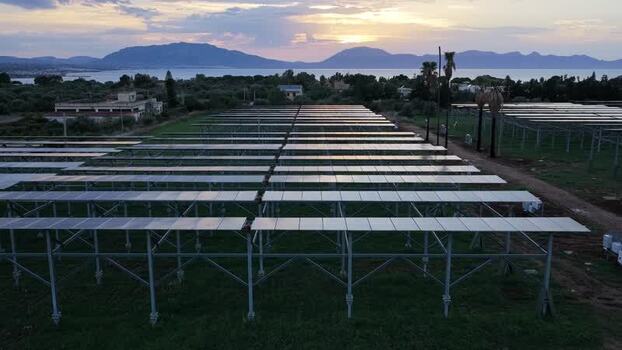 Aerial view of solar farm at sunset in Terrasini Italy.