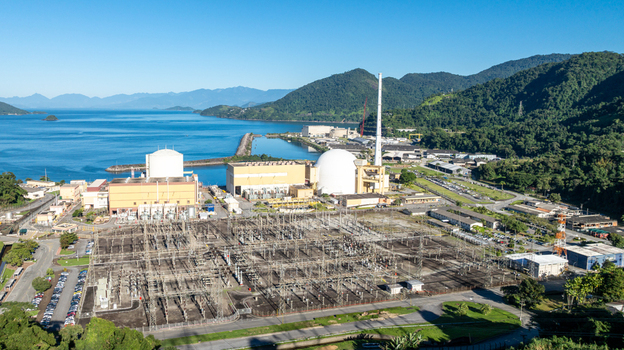 Aerial view of the Nuclear Power Plant Angra 2 with its electrical substation industrial buildings and containment dome along the coast of Angra dos Reis Rio de Janeiro Brazil.
