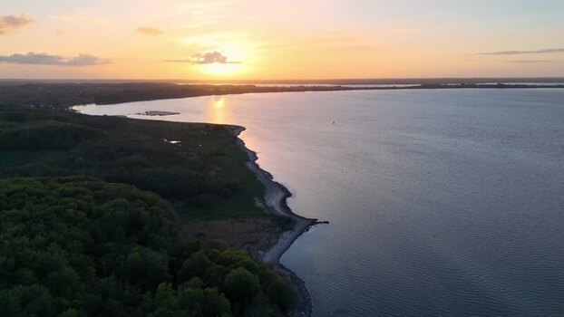 Aerial view of the sunset over Bockholmwik coastline Germany.