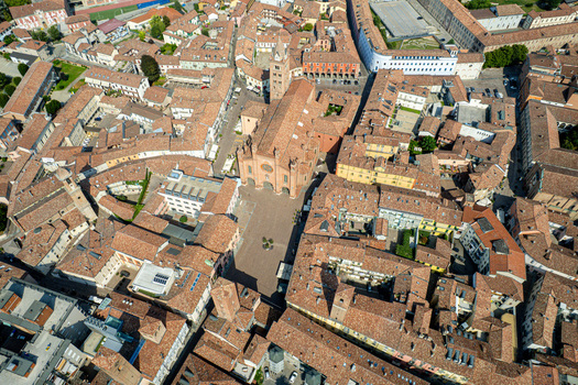 Aerial view of the Alba Cathedral and the historic center with its characteristic terracotta rooftops and narrow streets in Alba Piedmont Italy.