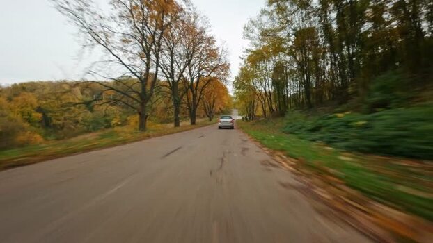 FPV aerial view of car on road in Fruska Gora SERBIA. FPV aerial view of car on road in Fruska Gora SERBIA.