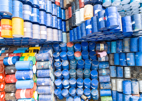 Aerial view of hundreds of colorful industrial metal barrels stacked in organized rows at a storage facility in Dhaka Dhaka Division Bangladesh. Aerial view of hundreds of colorful industrial metal barrels stacked in organized rows at a storage facility in Dhaka Dhaka Division Bangladesh.