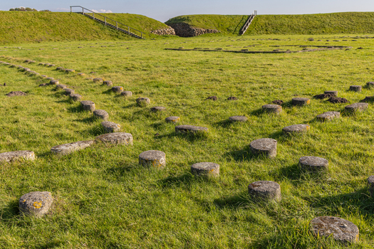 View of the historic Trelleborg Viking Fortress with its circular earthworks grassy ramparts and stone foundations of longhouses in Slagelse Sjaelland Denmark. View of the historic Trelleborg Viking Fortress with its circular earthworks grassy ramparts and stone foundations of longhouses in Slagelse Sjaelland Denmark.