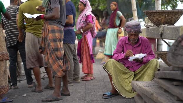 View of people eating and gathering at Aminbazar in Dhaka Bangladesh.