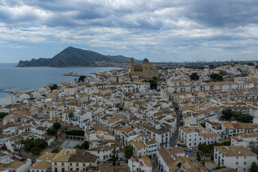Aerial view of the historic town of Altea with its iconic blue domed Church of Our Lady of Consolation white washed houses and coastal scenery Altea Valencian Community Spain.