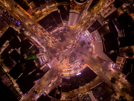 Aerial view of the pulsing heart of the city where golden lights weave through streets and buildings converge Dhaka Dhaka Division Bangladesh. Aerial view of the pulsing heart of the city where golden lights weave through streets and buildings converge Dhaka Dhaka Division Bangladesh.
