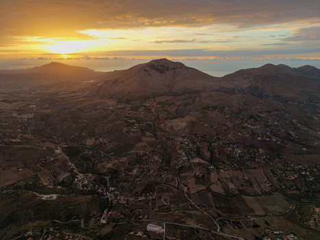 Aerial view of the rolling hills and agricultural landscape of Sicily at sunset near Palermo Sicily Italy. Aerial view of the rolling hills and agricultural landscape of Sicily at sunset near Palermo Sicily Italy.