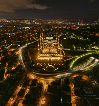 Aerial view of Grand Camlica Mosque illuminated at night overlooking the sprawling urban landscape of Uskudar Istanbul Turkiye. Aerial view of Grand Camlica Mosque illuminated at night overlooking the sprawling urban landscape of Uskudar Istanbul Turkiye.