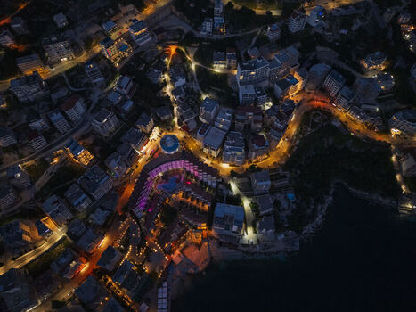 Aerial view of the coastal city of Saranda at night featuring illuminated streets hotels and buildings along the Ionian Sea coastline in Vlore County Albania. Aerial view of the coastal city of Saranda at night featuring illuminated streets hotels and buildings along the Ionian Sea coastline in Vlore County Albania.
