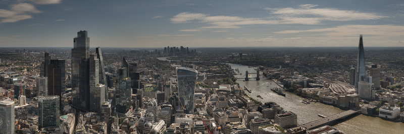 Aerial view of The Fenchurch Building and The Walkie Talkie overlooking the London skyline with the River Thames Tower Bridge and The Shard in London England United Kingdom. Aerial view of The Fenchurch Building and The Walkie Talkie overlooking the London skyline with the River Thames Tower Bridge and The Shard in London England United Kingdom.