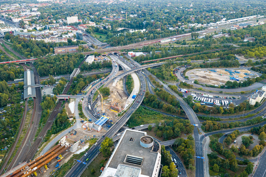 Aerial view of Ringbahnbrucke bridge construction at the Funkturm interchange with surrounding highways railway tracks and urban greenery in Berlin Berlin Germany. Aerial view of Ringbahnbrucke bridge construction at the Funkturm interchange with surrounding highways railway tracks and urban greenery in Berlin Berlin Germany.