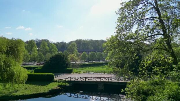 Aerial view of Woluwe Park with a wooden bridge and lush trees Belgium. Aerial view of Woluwe Park with a wooden bridge and lush trees Belgium.