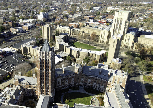 Aerial view of Yale University featuring the Harkness Tower and gothic architecture surrounded by campus buildings and green courtyards in New Haven Connecticut United States.