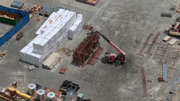 Aerial view of a telehandler at a construction site United States. Aerial view of a telehandler at a construction site United States.