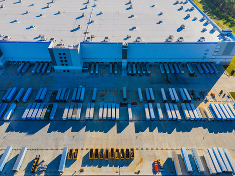 Wilmington North Carolina United States 27 September 2026 Aerial view of Amazon Robotics Fulfillment Center ILM1 with semi trailers at loading docks and large warehouse roof. Wilmington North Carolina United States 27 September 2026 Aerial view of Amazon Robotics Fulfillment Center ILM1 with semi trailers at loading docks and large warehouse roof.