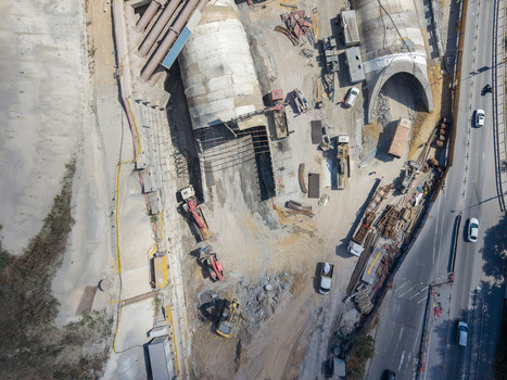 Aerial view of a tunnel construction site featuring heavy machinery excavators and concrete tunnel segments under development in Istanbul Istanbul Turkiye. Aerial view of a tunnel construction site featuring heavy machinery excavators and concrete tunnel segments under development in Istanbul Istanbul Turkiye.