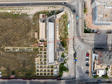 Aerial view of the construction site near the port authorities with a crane concrete foundations and adjacent road in San Benedetto del Tronto Marche Italy. Aerial view of the construction site near the port authorities with a crane concrete foundations and adjacent road in San Benedetto del Tronto Marche Italy.