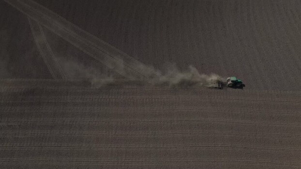 Aerial view of a tractor plowing a field Portugal. Aerial view of a tractor plowing a field Portugal.