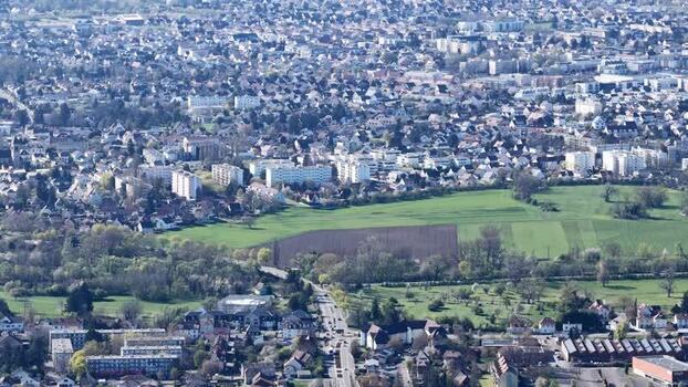 Aerial view of buildings and green fields France.