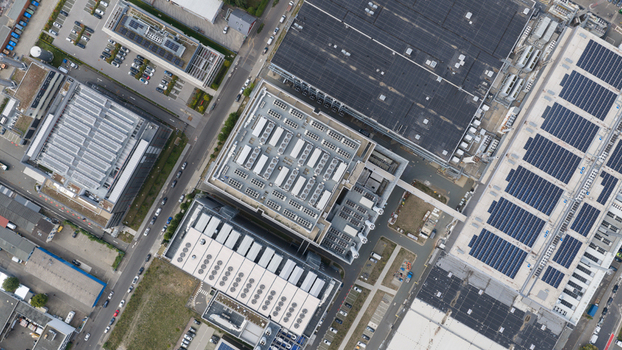 Aerial view of the Equinix Data Center with its industrial rooftops cooling units and solar panels in Frankfurt am Main Hessen Germany.