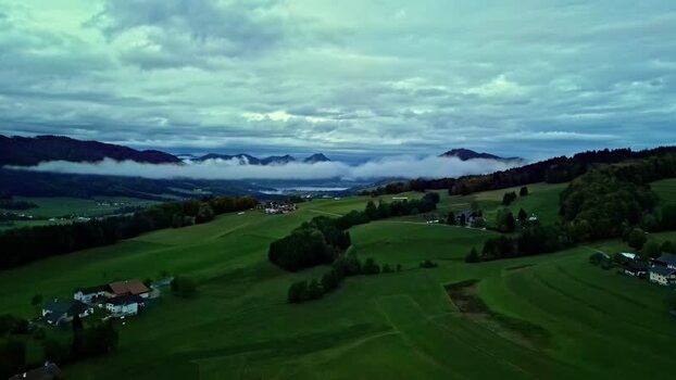 Aerial view of Attersee and rolling hills in Austria.