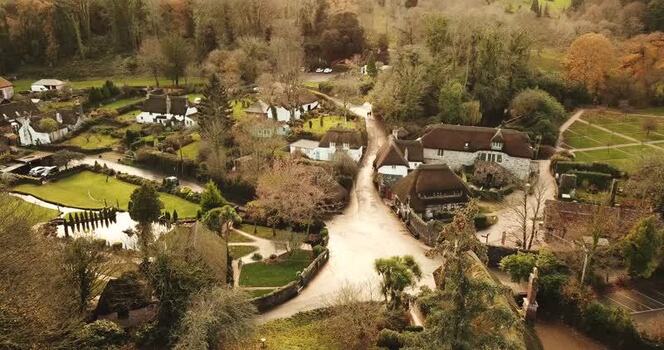 Aerial view of thatched cottages in Cockington United Kingdom. Aerial view of thatched cottages in Cockington United Kingdom.