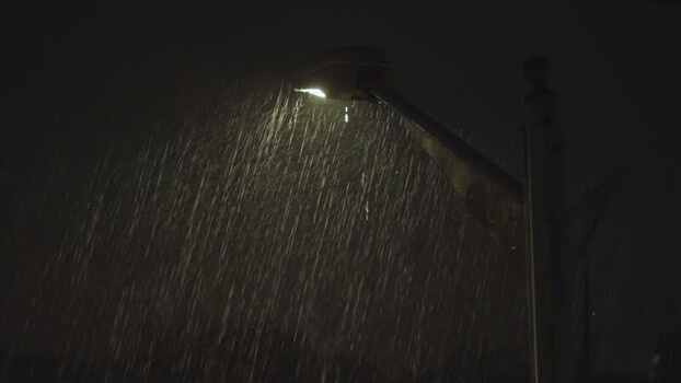 Aerial view of street lamp in rain at night Algeria.