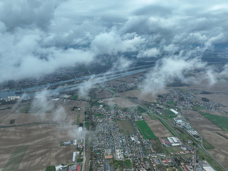 Aerial view of the city and its landscape with a river flowing through it all seen under a sky filled with fluffy clouds Neuf Brisach Grand Est France.
