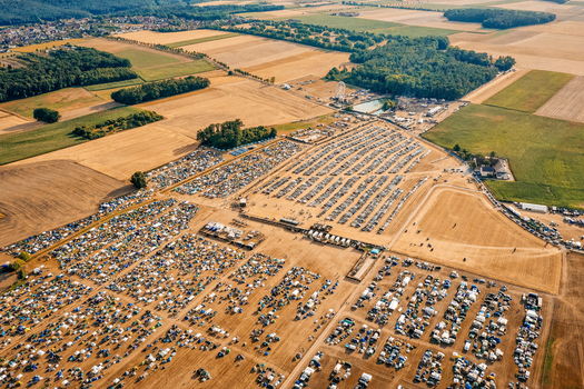 Aerial view of the Open Beatz Festival grounds with thousands of tents and cars parked in fields near Herzogenaurach Bayern Germany. Aerial view of the Open Beatz Festival grounds with thousands of tents and cars parked in fields near Herzogenaurach Bayern Germany.
