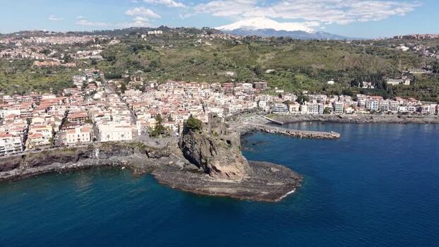 Aerial view of Castello Normanno and Mount Etna Italy. Aerial view of Castello Normanno and Mount Etna Italy.
