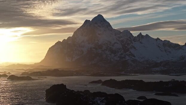 Aerial view of Lofoten mountains at golden hour Norway.