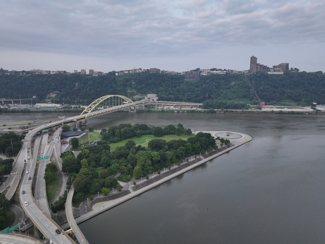 Aerial view of Point State Park Fountain at the confluence of the rivers with the Fort Pitt Bridge and the city skyline in the background in Pittsburgh Pennsylvania United States.