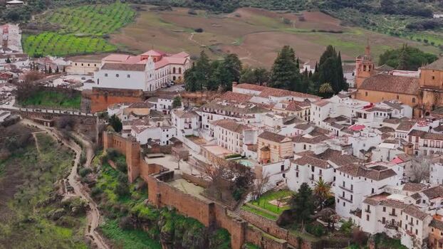 Aerial view of the historic walled city and gorge in Ronda Spain. Aerial view of the historic walled city and gorge in Ronda Spain.
