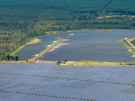 Aerial view of the former Military Airfield Preschen now a solar farm with panels covering the historic runway and taxiway surrounded by forest in Neisse Malxetal Brandenburg Germany. Aerial view of the former Military Airfield Preschen now a solar farm with panels covering the historic runway and taxiway surrounded by forest in Neisse Malxetal Brandenburg Germany.