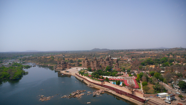 Orchha India 08 May 2026 Aerial view of the historic Orchha Fort complex and the Betwa River with ancient stone architecture and lush greenery under a clear blue sky. Orchha India 08 May 2026 Aerial view of the historic Orchha Fort complex and the Betwa River with ancient stone architecture and lush greenery under a clear blue sky.