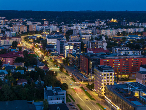 Aerial view of the illuminated cityscape of Vilnius at night with glowing street lights and modern buildings in Vilnius Vilnius County Lithuania. Aerial view of the illuminated cityscape of Vilnius at night with glowing street lights and modern buildings in Vilnius Vilnius County Lithuania.