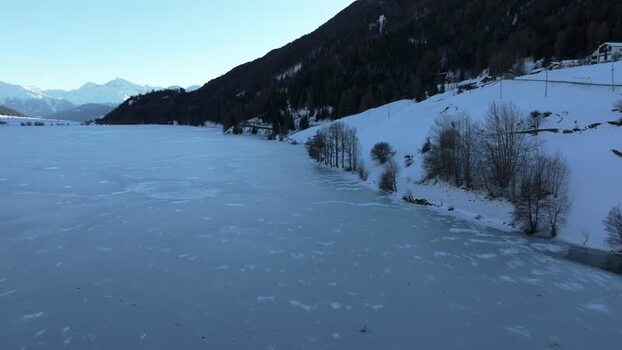 Aerial view of frozen Lake Reschen in Graun im Vinschgau Italy. Aerial view of frozen Lake Reschen in Graun im Vinschgau Italy.