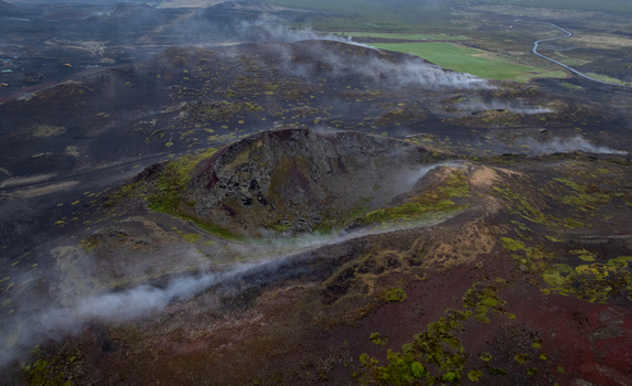 Aerial view of Hverir geothermal area with steaming vents volcanic craters and rugged lava fields in Reykjahlid Thingeyjarsveit Iceland. Aerial view of Hverir geothermal area with steaming vents volcanic craters and rugged lava fields in Reykjahlid Thingeyjarsveit Iceland.