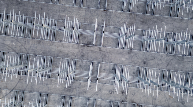 Aerial view of a multi level vehicle storage structure with metal framing in Livron sur Drome Auvergne Rhone Alpes France.