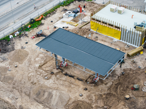 Aerial view of a new gas station under construction with a metal canopy structure piles of dirt and building materials on a site in Riga Latvia. Aerial view of a new gas station under construction with a metal canopy structure piles of dirt and building materials on a site in Riga Latvia.