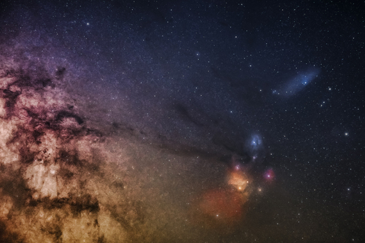 View of the starry night sky featuring cosmic dust colorful nebulae Rho Ophiuchi and distant stars in Poland.