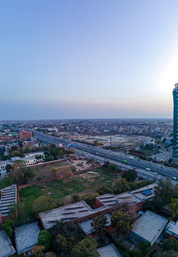 Aerial view of Arfa Software Technology Park and Ferozepur Road with urban sprawl and rooftops under a clear sky in Lahore Punjab Pakistan. Aerial view of Arfa Software Technology Park and Ferozepur Road with urban sprawl and rooftops under a clear sky in Lahore Punjab Pakistan.