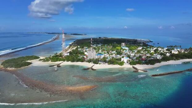 Aerial view of Thulusdhoo island with turquoise waters Maldives. Aerial view of Thulusdhoo island with turquoise waters Maldives.